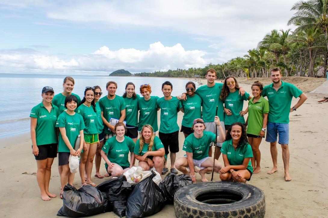 Group of volunteers after a beach cleanup Group of volunteers after a beach cleanup